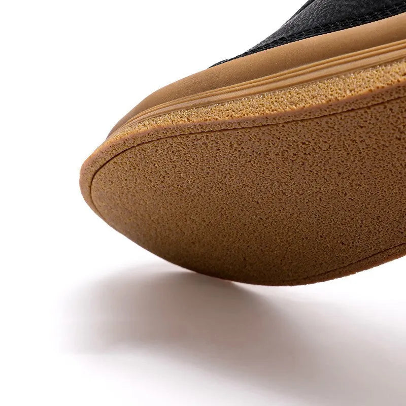 Men's black casual leather shoes with round toe and lace-up front on a white background.