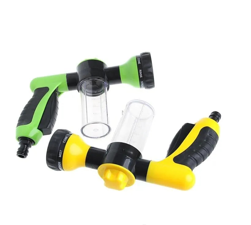 Green high-pressure foam spray gun for car washing with adjustable nozzle and attached water pipe.