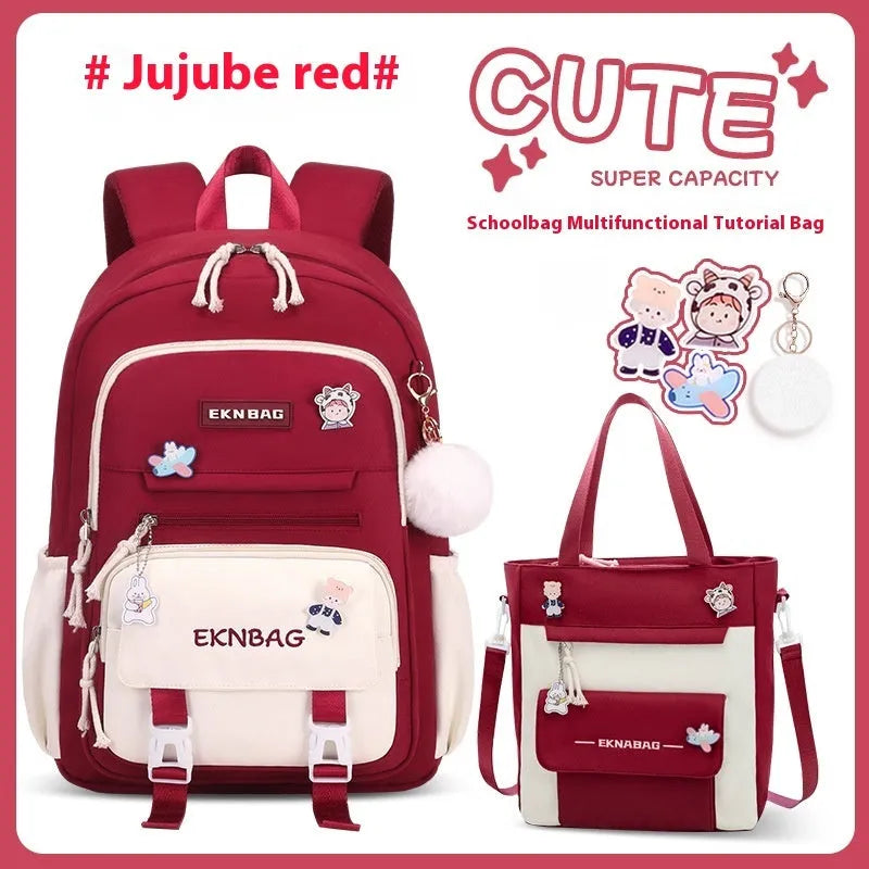 Pink waterproof Oxford cloth school backpack for girls with curved shoulder straps.