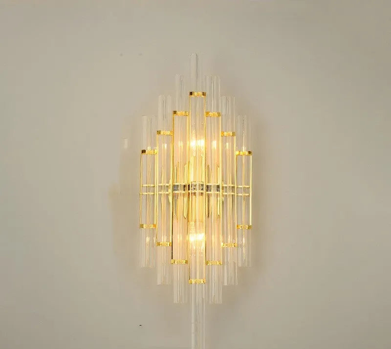 Modern crystal wall lamp with petal design and titanium gold finish mounted on wall