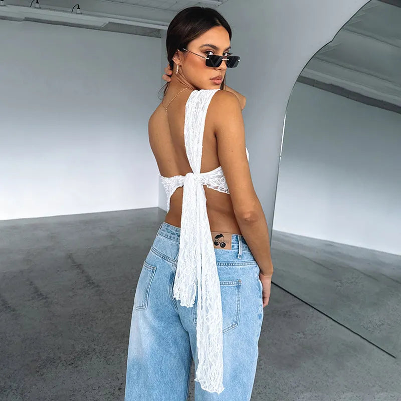 Women's backless sleeveless top with lace-up closure and asymmetrical neckline in solid colour