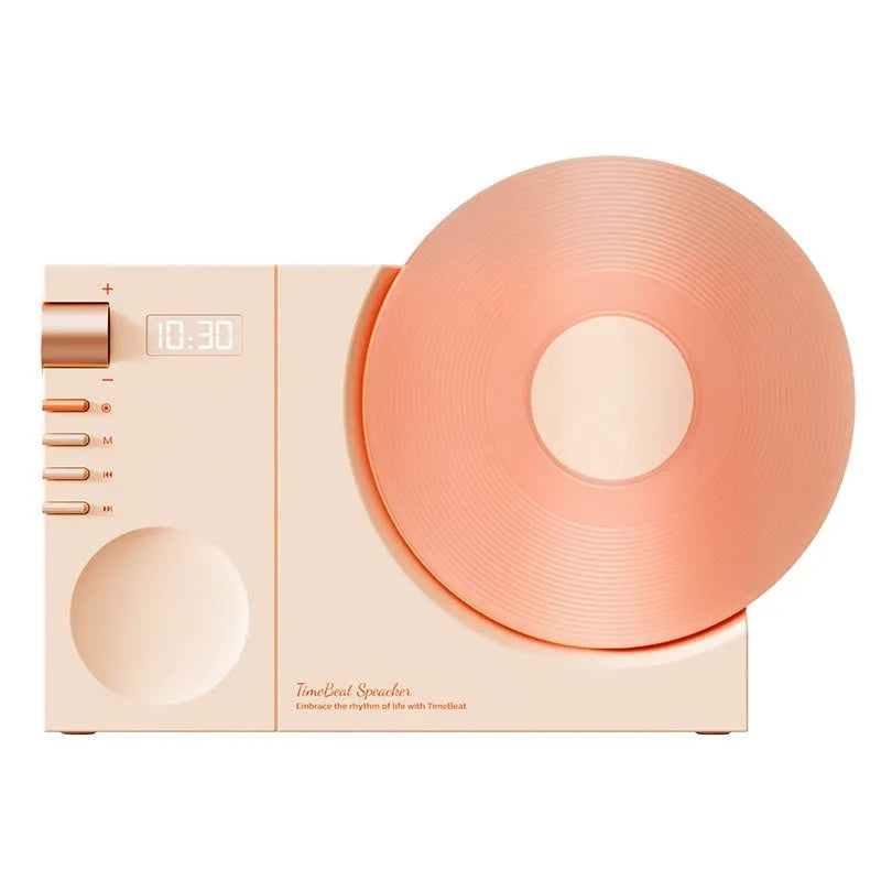 Mini portable Bluetooth speaker in Coral Pink colour with USB charging port.
