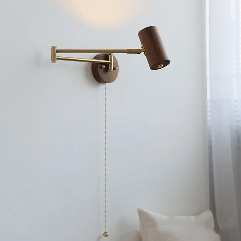 Retro-style long-arm wall spotlight with rotating head in walnut finish and a ribbon pull switch.