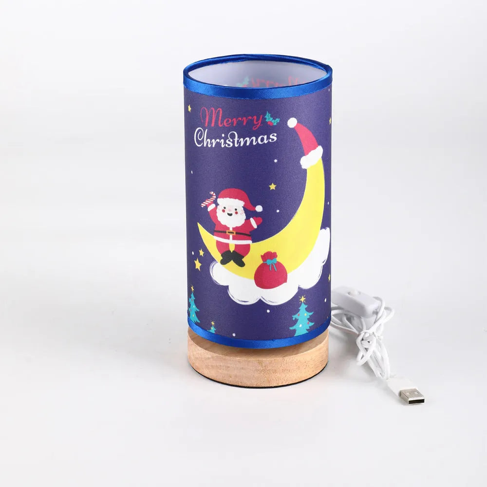 Moon and Santa Claus themed LED night light with a bamboo base and USB plug cable.