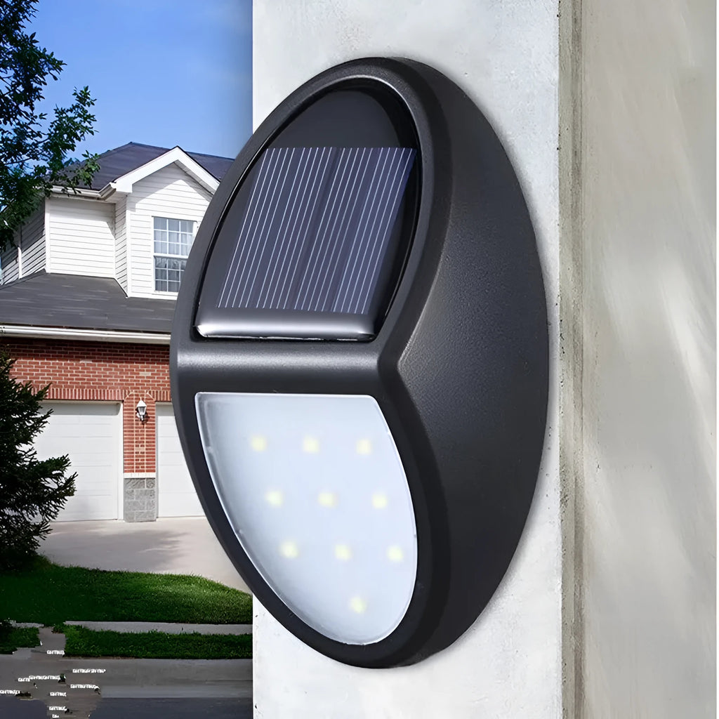 Black rectangular solar wall light with solar panel and LED illumination for outdoor use