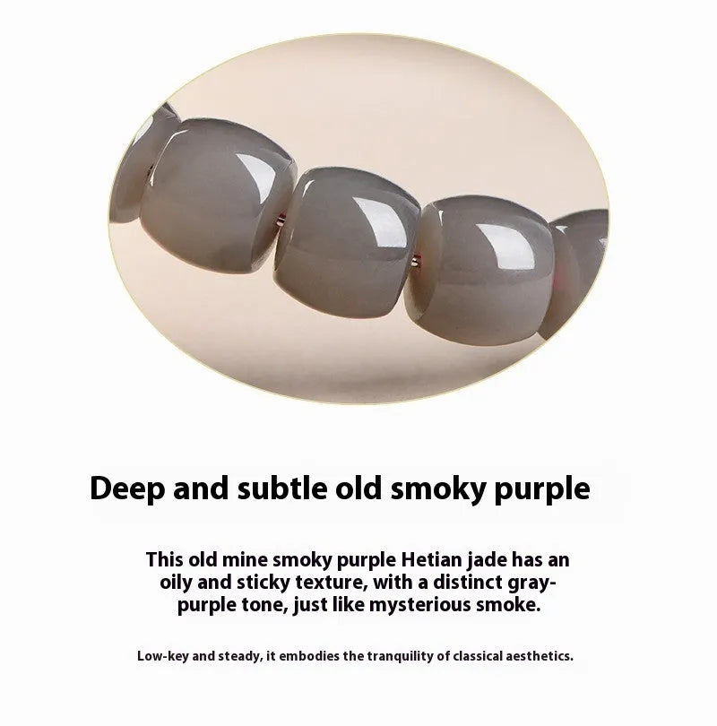 Hetian jade Smokey Violet bracelet with straight cut beads on a wrist.