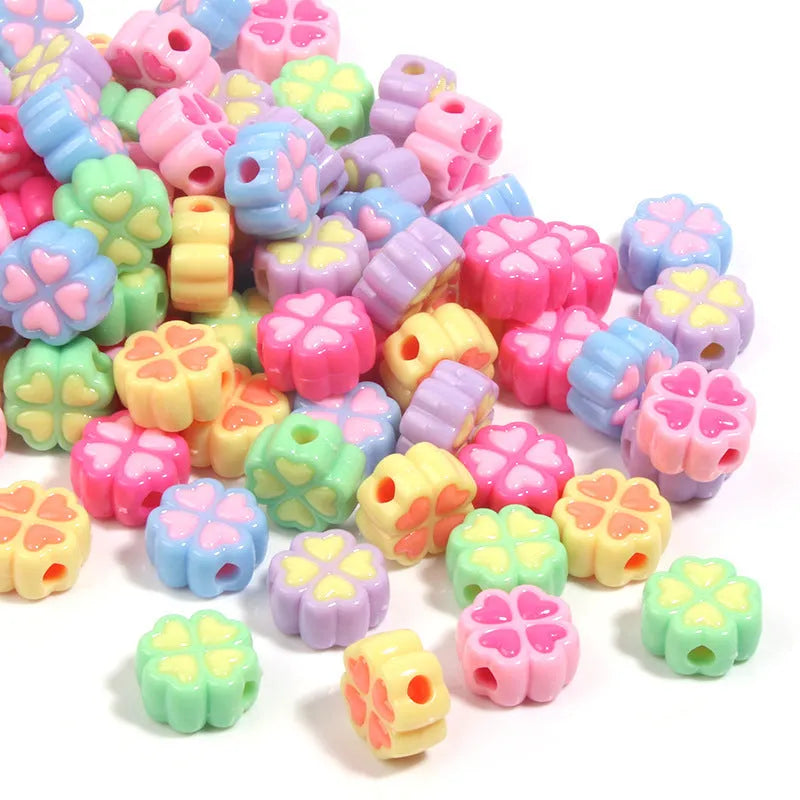 15mm acrylic clover craft beads with frosted finish in multiple colours including pink, blue, yellow, and green