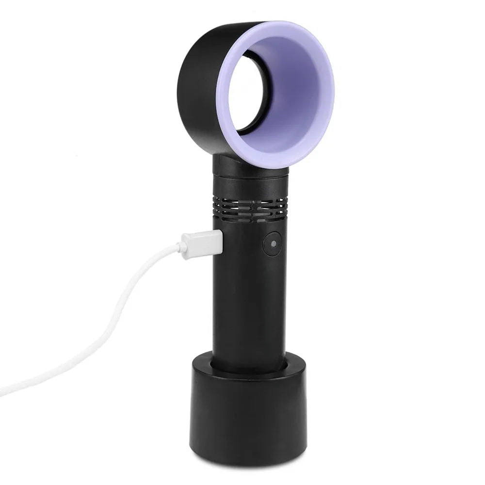 Compact portable bladeless desk fan with USB charging cable on a wooden desk