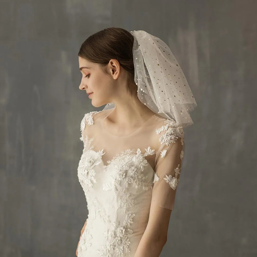 White yarn bridal multi-layer short veil with hair comb on a neutral background
