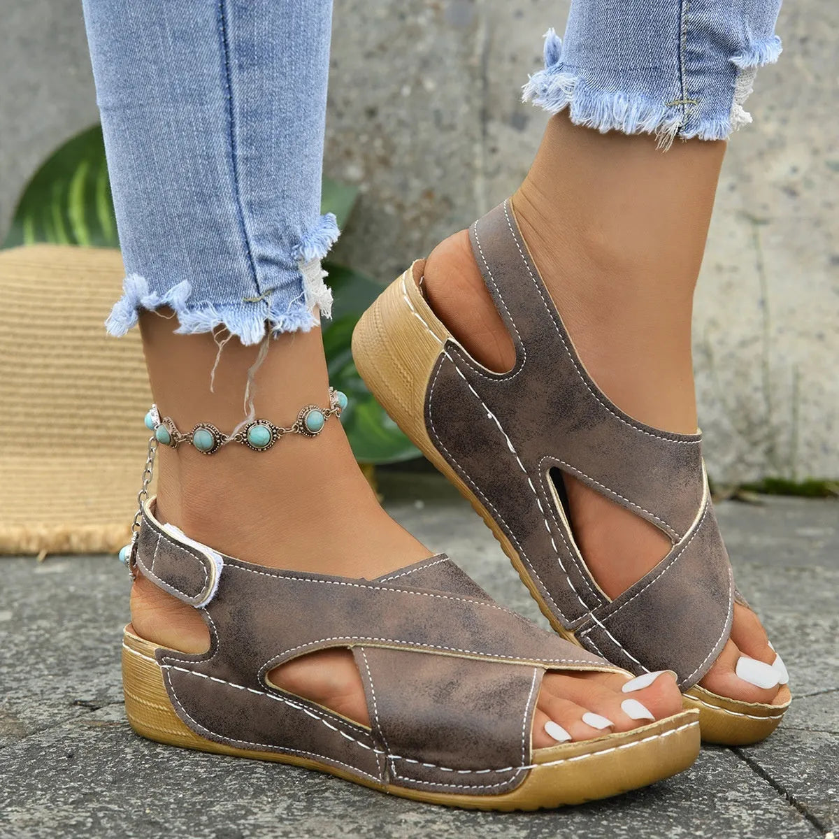 Women's Roman platform sandals with skirt detail, open toe, and adjustable velcro strap.