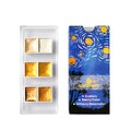 Boxed set of solid watercolour pigment blocks in pearlescent colours on a white background.