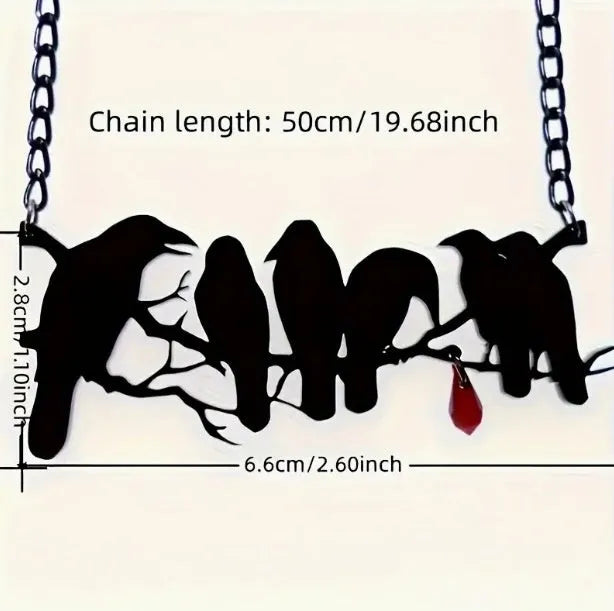 Black alloy crow pendant necklace on a cross chain for women, gothic bird motif jewellery.