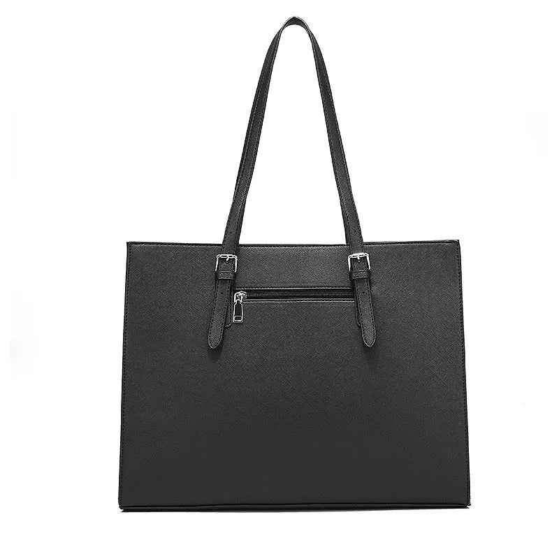 Large black women's business shoulder bag showing triple strap options and internal organisation compartments