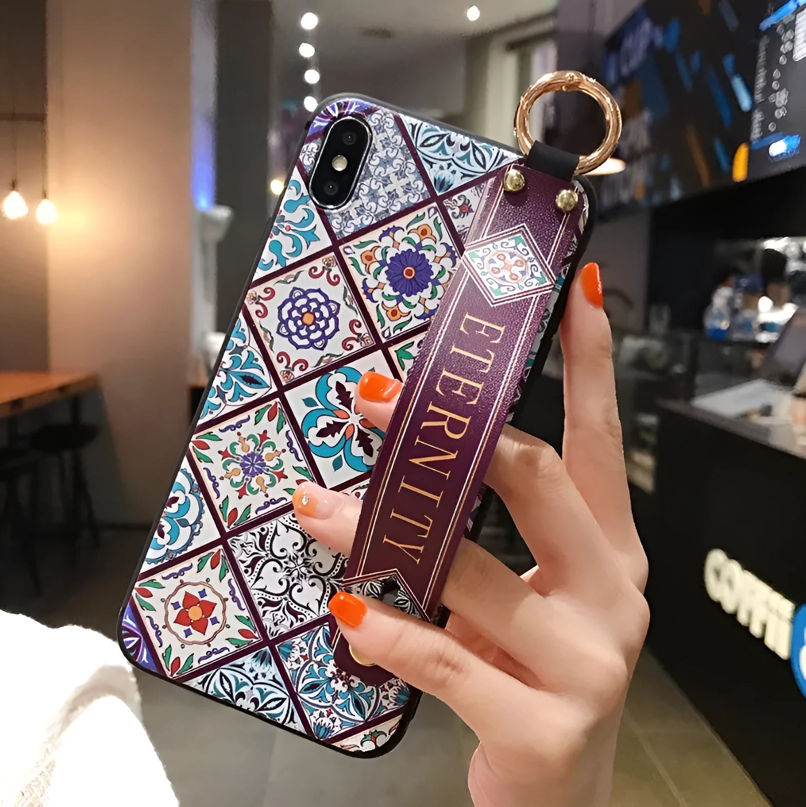 Samsung Galaxy phone case with folding bracket extended, showing floral pattern design