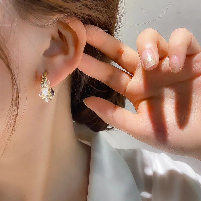 Green flower earrings with real gold plating, 925 silver needle, and diamond processing on an alloy body, gold colour