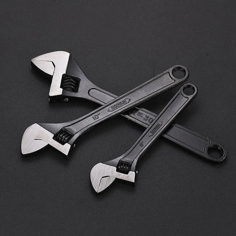 15-inch stainless steel adjustable open-end wrench with a blackened head and ergonomic handle.