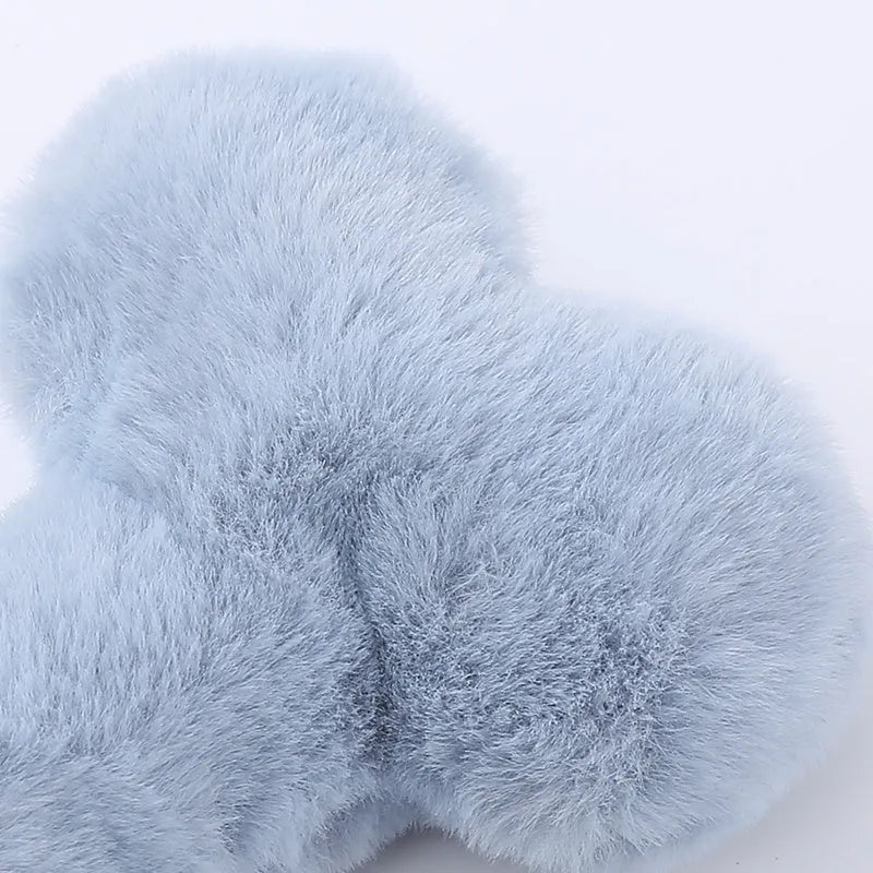 Plush love bone dog toy with squeaker in blue, pink, or yellow colours for interactive play