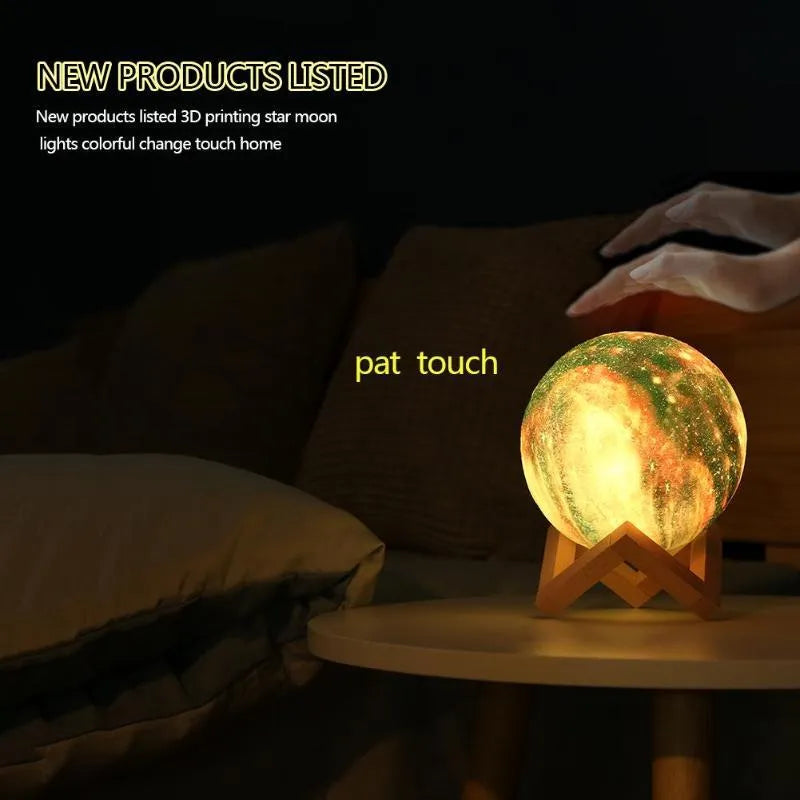 3D-printed spherical moon night light glowing with colour-changing LEDs on a dark surface.