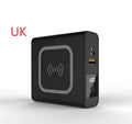 Black Super QI 10000mAh power bank with wireless charging top and foldable UK plug adapter attached.