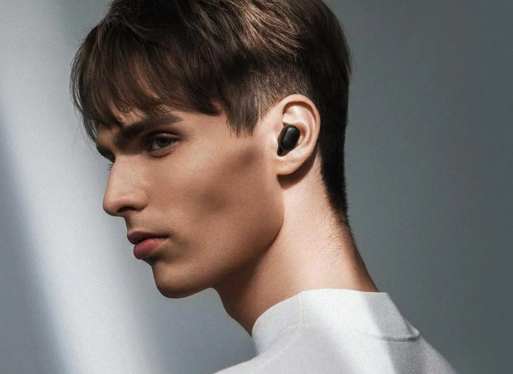 Black Redmi AirDots true wireless Bluetooth earbuds with a charging case.