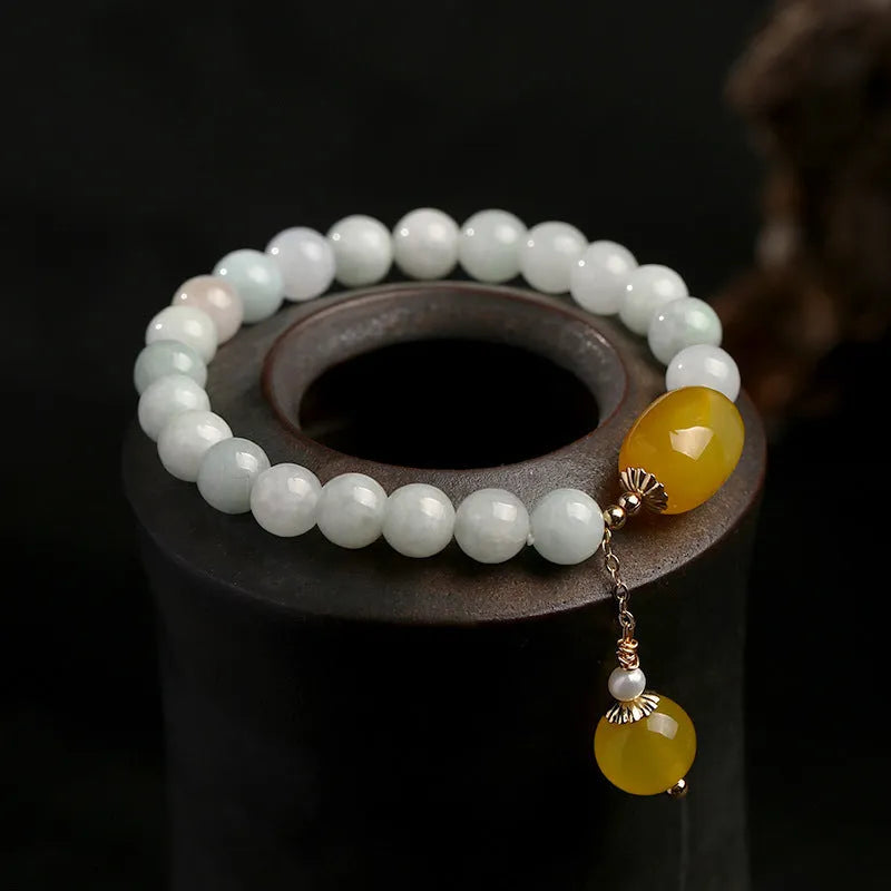Women's ethnic geometric bracelet with hanging red agate beads and 14K gilded finish