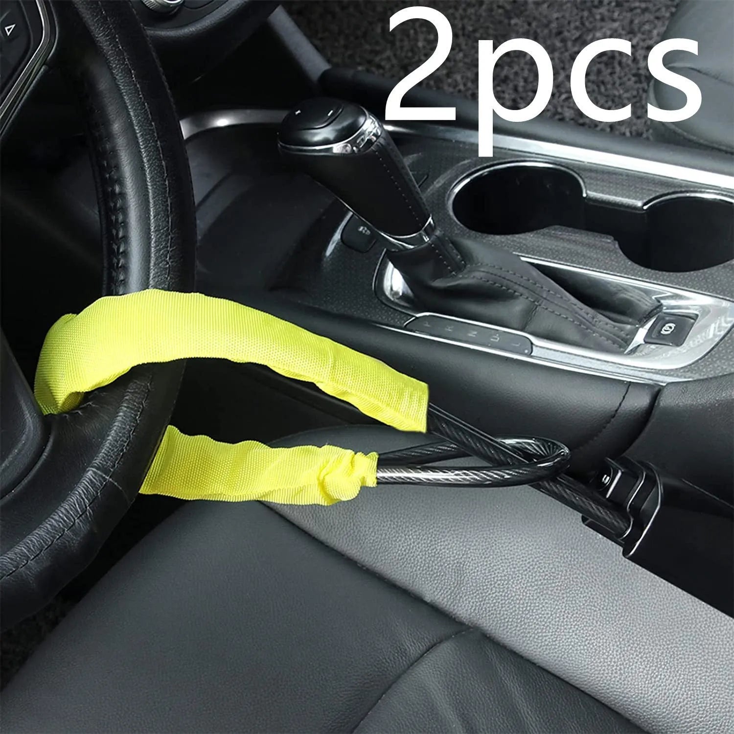Red iron car steering wheel lock with wire rope for General Motors vehicles on a steering wheel.
