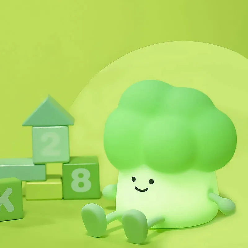 Cartoon eggplant small night lamp with soft yellow light beside broccoli design night light