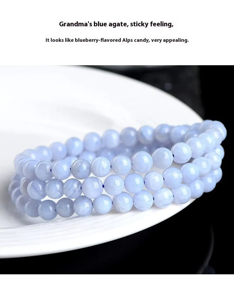 Blue agate bracelet with Ruyi symbol and scattered beads measuring 6-6.8mm.