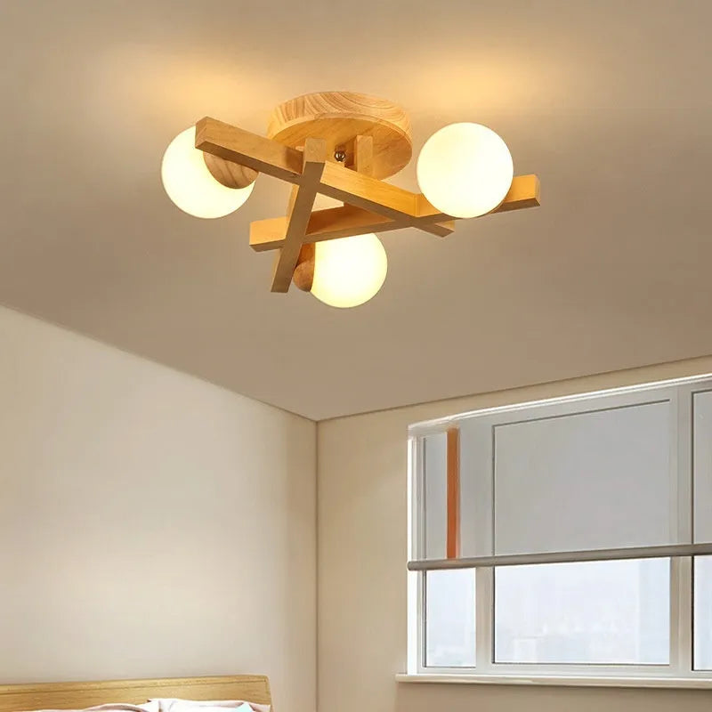 Nordic wooden-style ceiling light with three adjustable heads in a modern living room setting.
