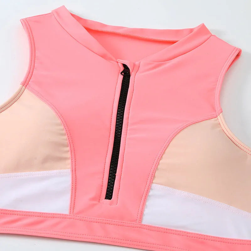 Pink high-waisted bikini set with sleeveless top and shorts on a mannequin