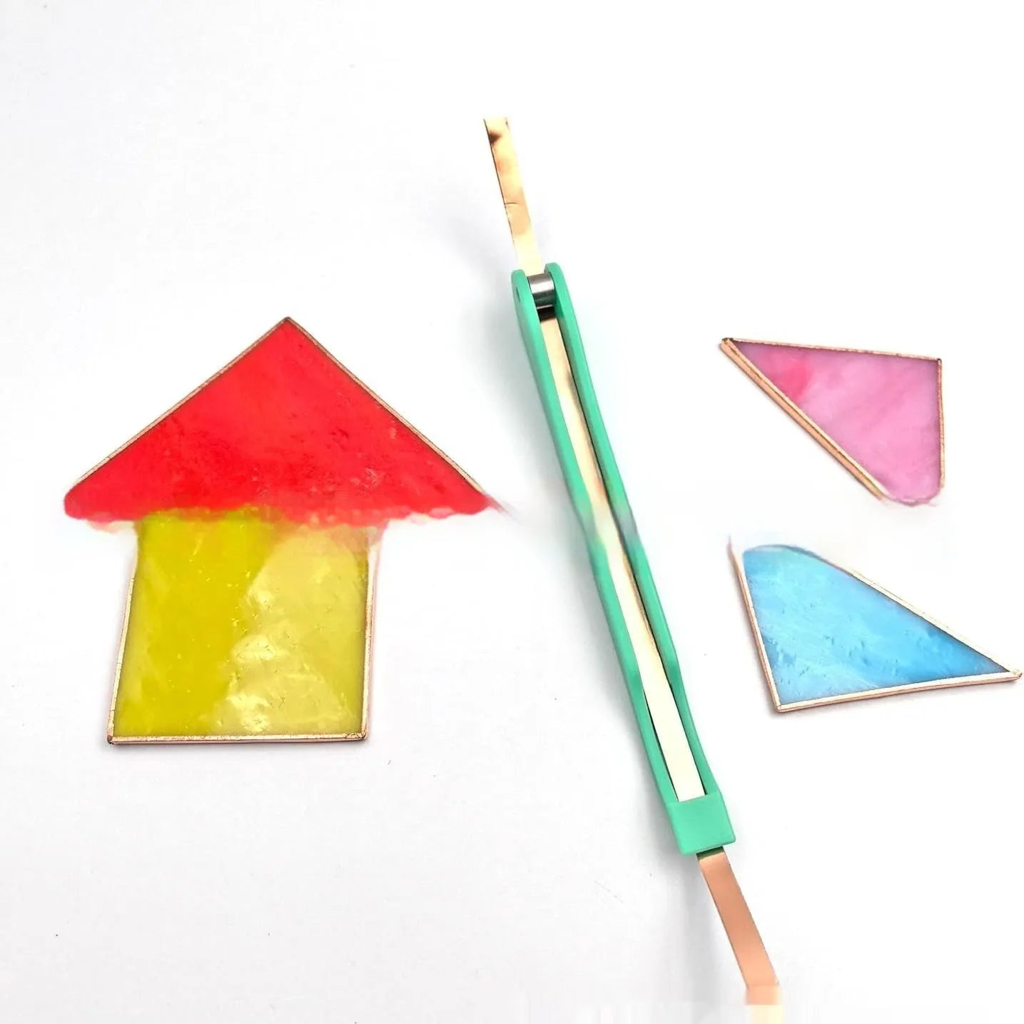 Plastic hand foil tool in green on white background, 14cm length for nail art