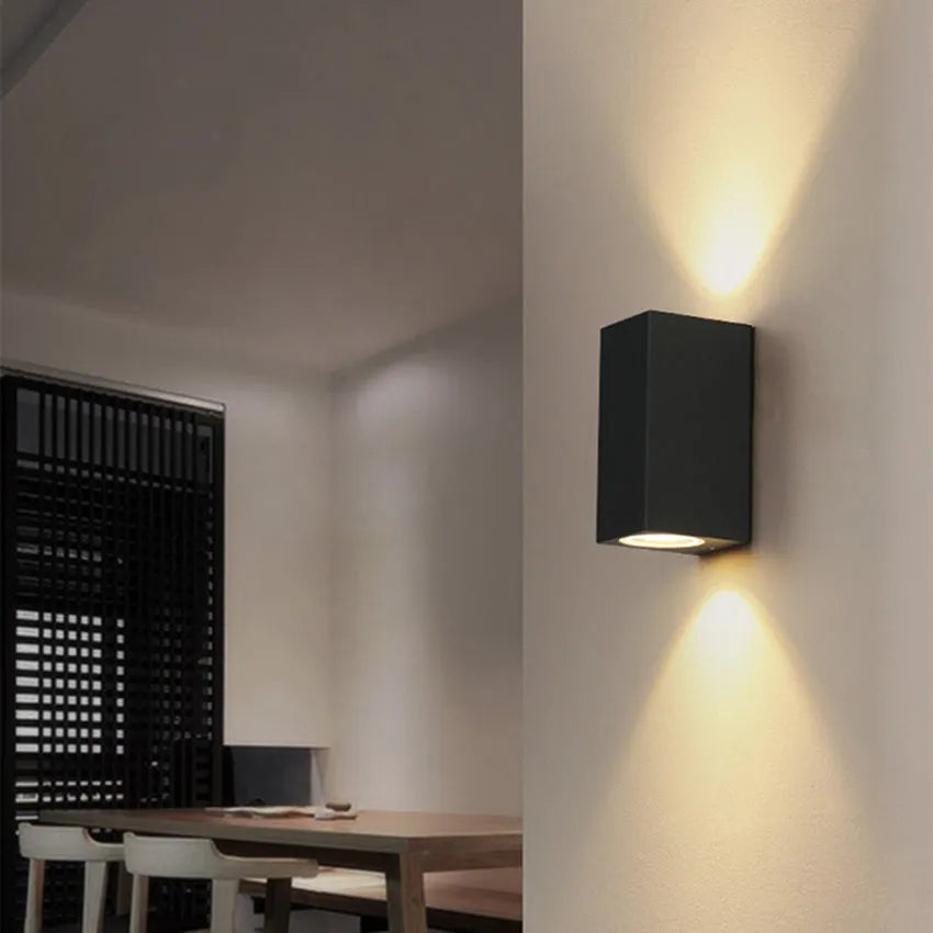 Black aluminium and glass wall-mounted LED lamp with choice of 10W or 12W power.