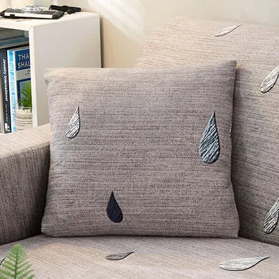 Geometric patterned stretch sofa slipcover fitted on a three-seater sofa