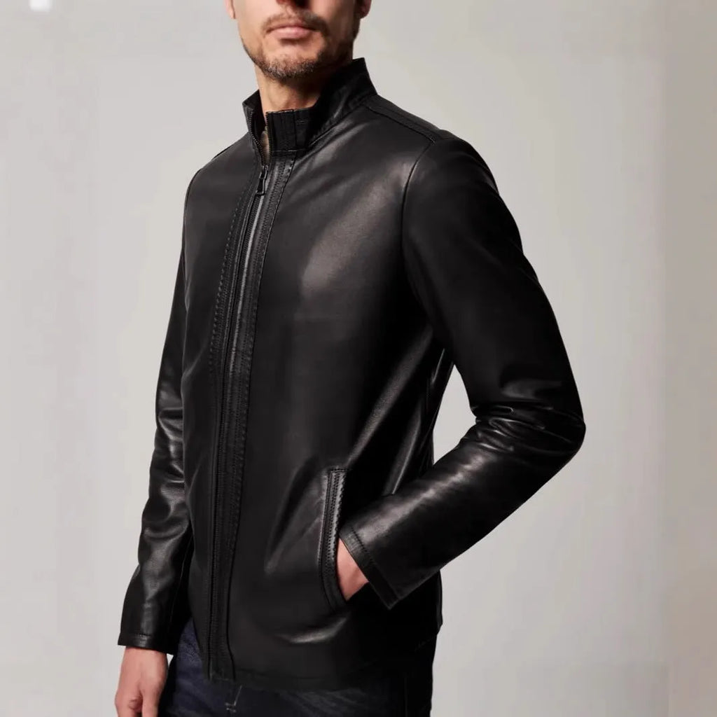 Black men's retro leather jacket with long sleeves and straight hem on a hanger