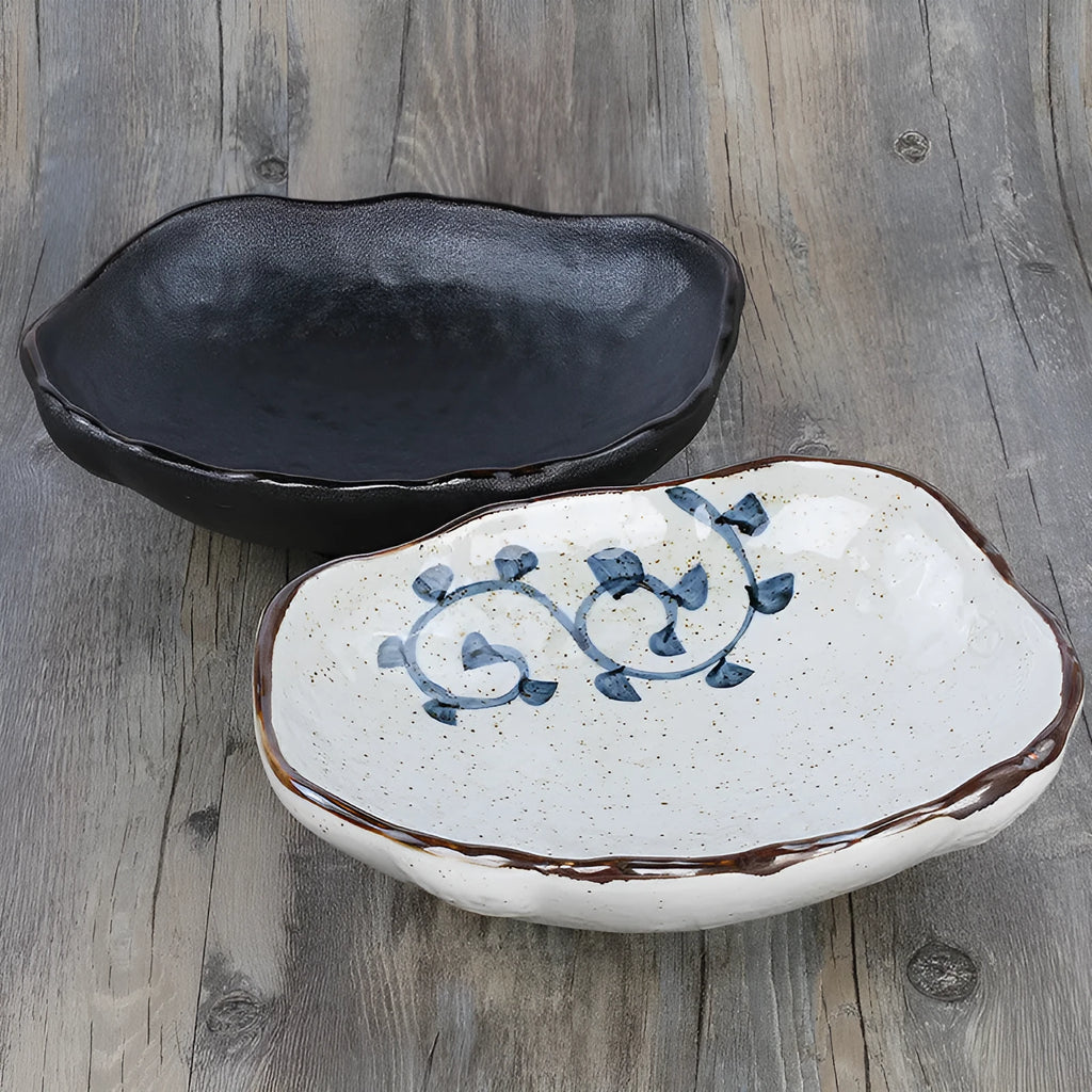 Creative ceramic Japanese-style irregular shaped bowl with floral decoration and sauce dish