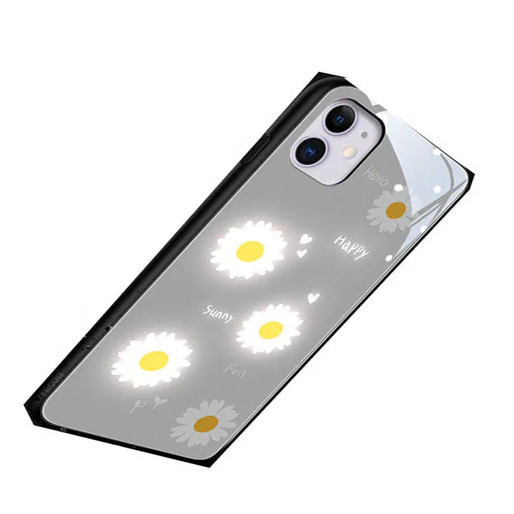 White TPU iPhone case with painted purple daisies and letters, showing voice-activated colour light feature.
