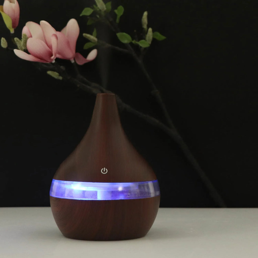 USB mini tip air purifier humidifier in wood grain, columnar shape, less than 1L tank, one fog outlet, 2-8 hour timer.