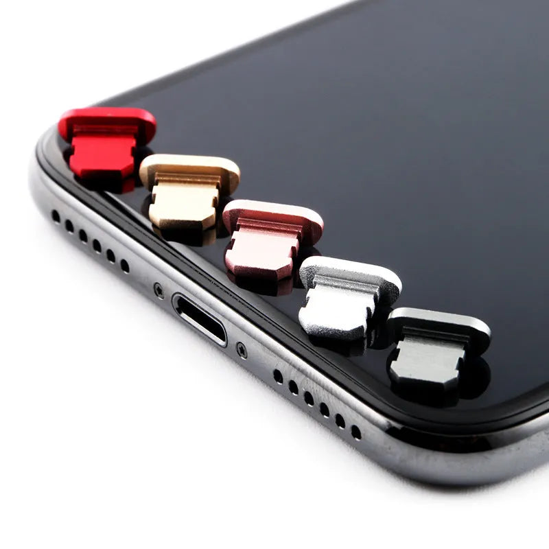 Aluminium alloy charging port dust plug for iPhone in various colours including gold, silver, blue, and black.