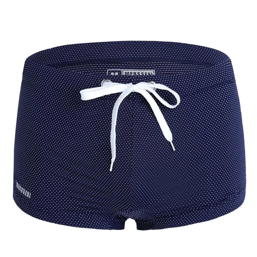 Men's solid colour nylon lace low waist swimming trunks in boxer briefs style.