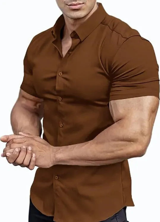 Man wearing a brown short sleeve printed casual shirt with a collar.