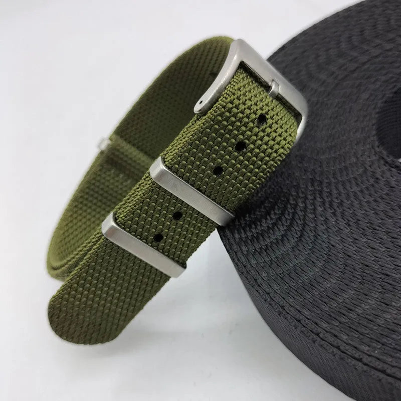 Nylon integrated watch strap in army green colour showing textile texture and buckle.