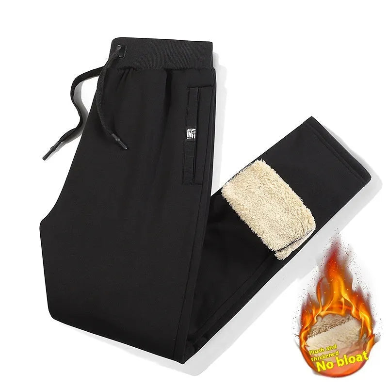 Men's grey fleece-lined oversized track pants with elastic waistband