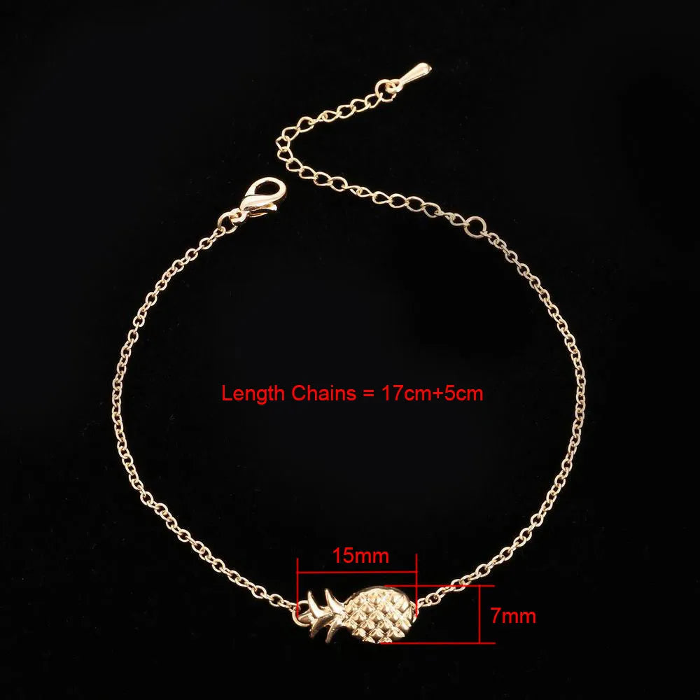 Women's alloy pineapple charm bracelet in gold or silver finish from XINGX series.
