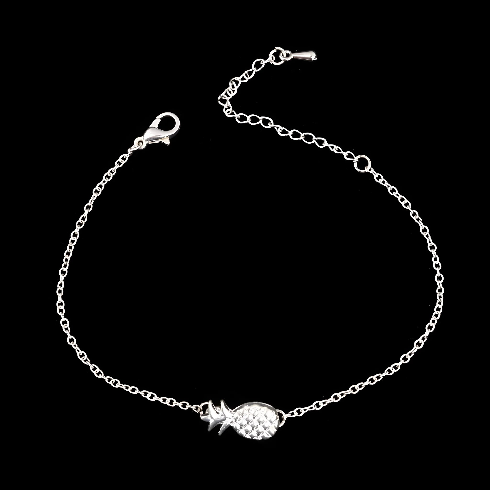 Women's alloy pineapple charm bracelet in gold or silver finish from XINGX series.