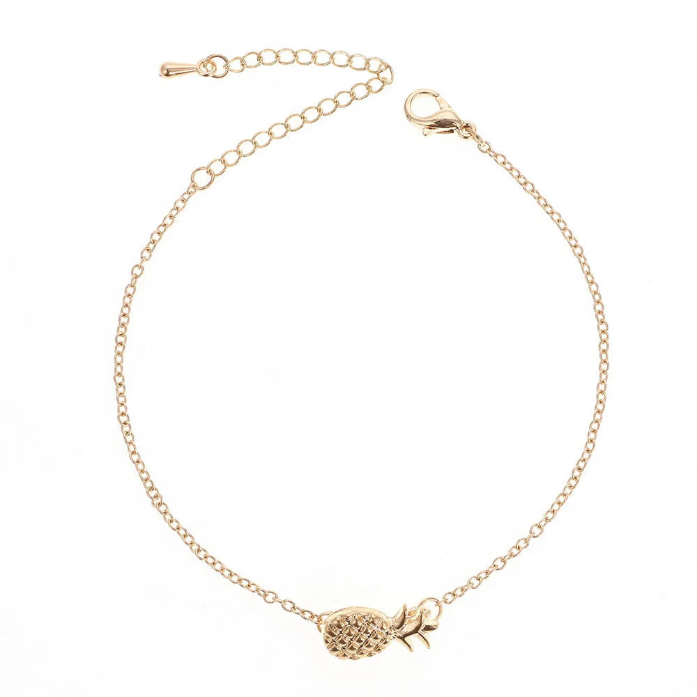 Women's alloy pineapple charm bracelet in gold or silver finish from XINGX series.