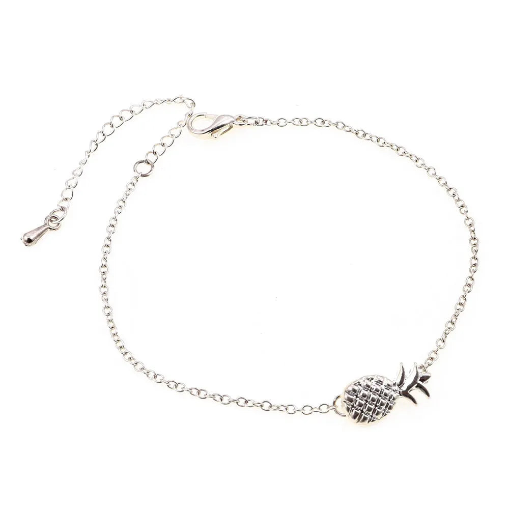 Women's alloy pineapple charm bracelet in gold or silver finish from XINGX series.