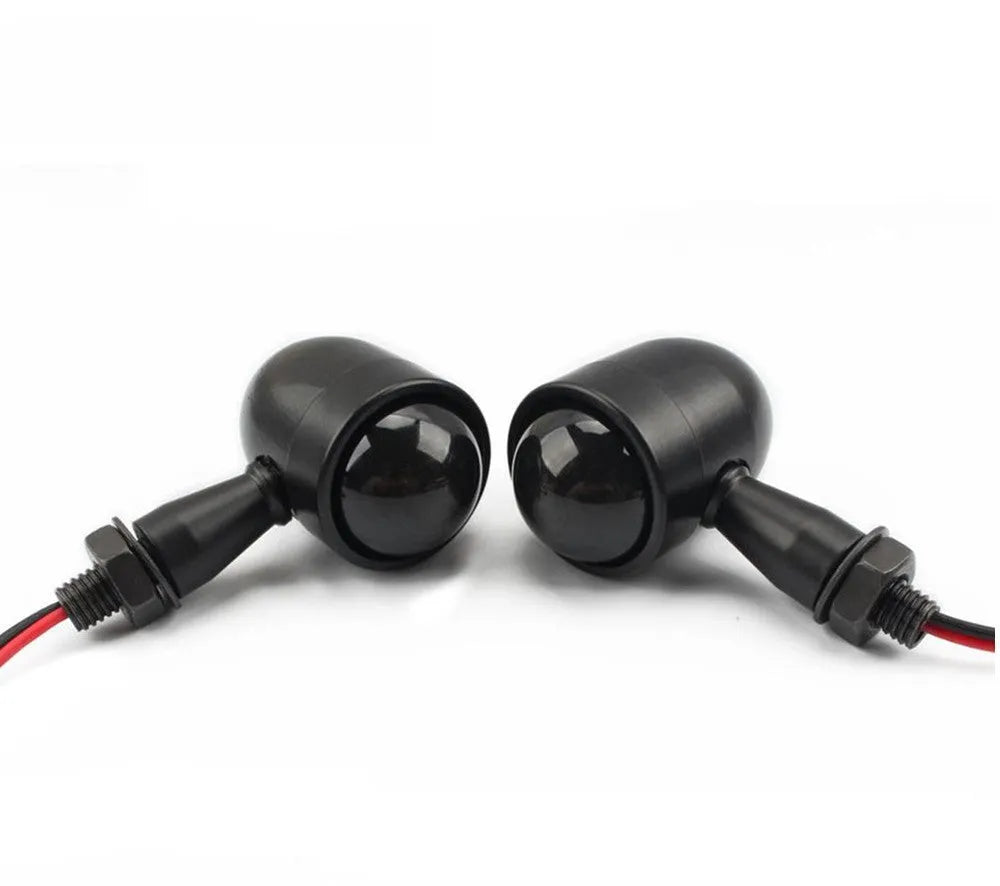 Motorcycle turn signal with metal back shell, plastic lens, 12V 2-wire connection, and 10mm mounting bolt thread