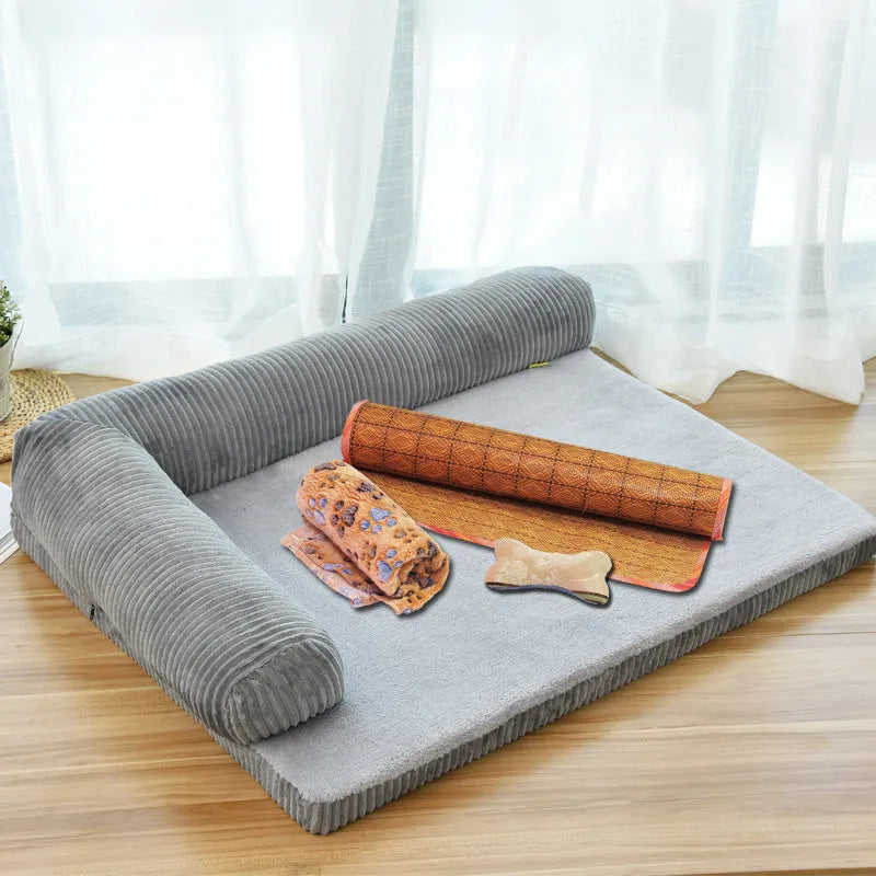 A grey corduroy bilateral-style dog sofa bed on a wooden floor