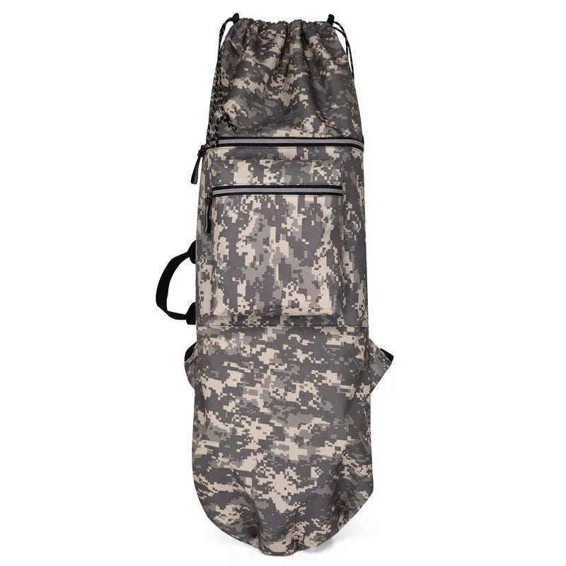 Black waterproof skateboard backpack with a longboard strapped to the side, showing padded shoulder straps.