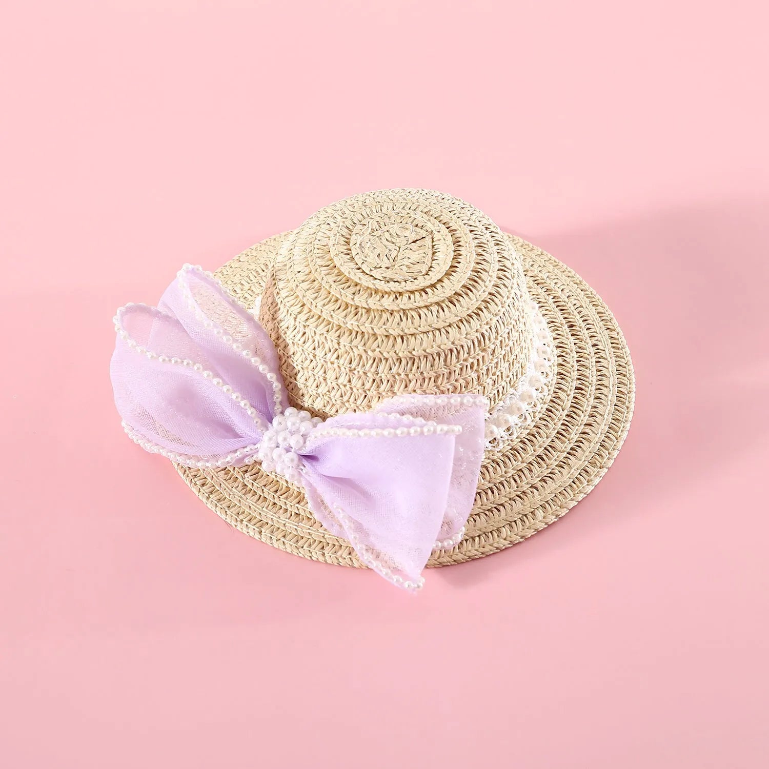 Princess-style woven cat hat with pearl butterfly bow in blue, pink, purple, or white on Lafite leaves.